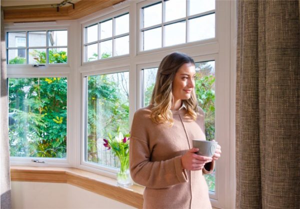 Woman standing in front of a window